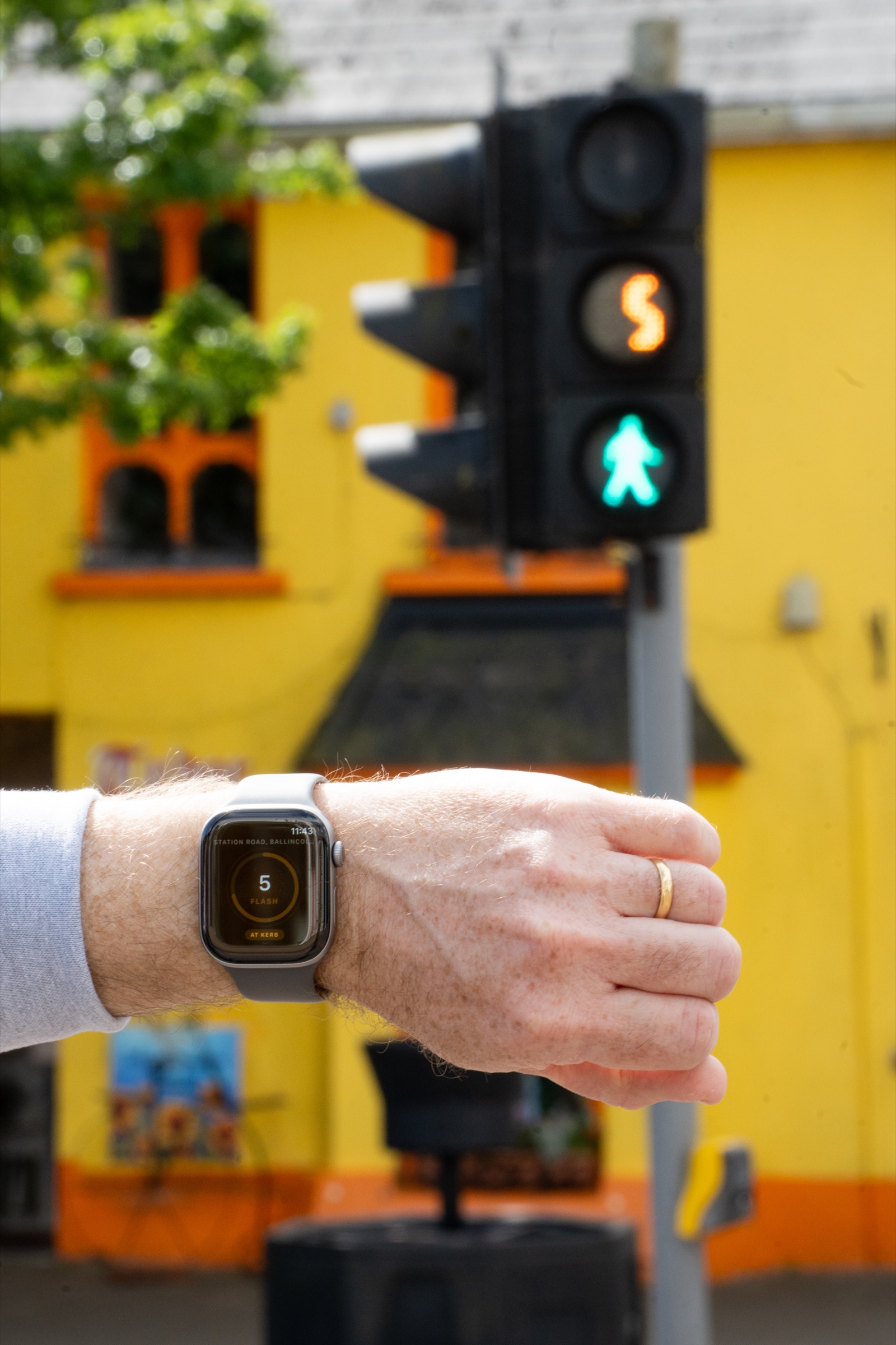 WalkPhase running on Apple Watch at the same Cork crossing — flashing-phase countdown matches the signal head behind